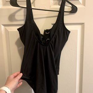 Black Michael Kors one piece bathing suit.